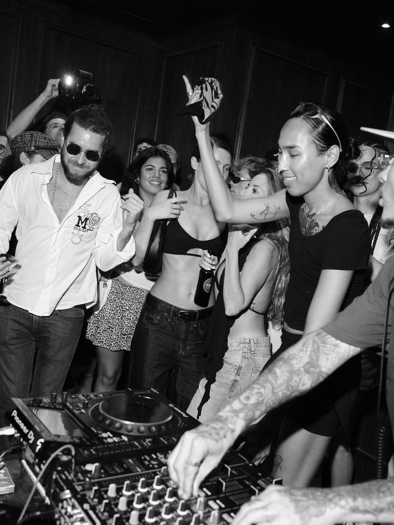 DJ and crowd celebrating at El Santo Barcelona club event by maik studio