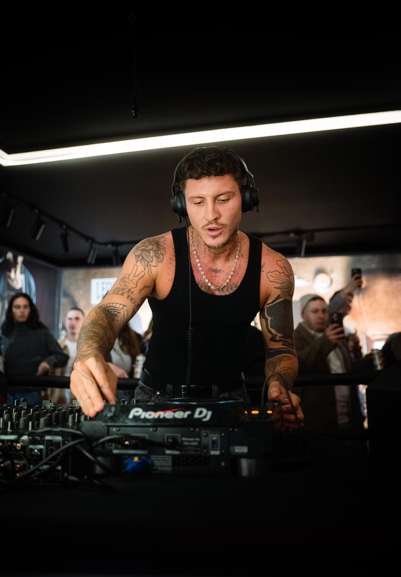 DJ performing at Leone Shop Barcelona inauguration with Pioneer DJ equipment